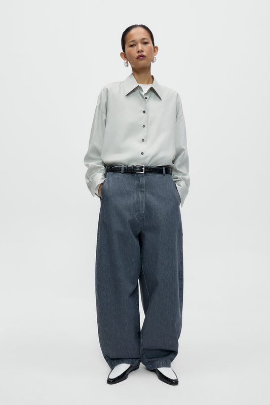 WASHED DENIM CURVED PANTS